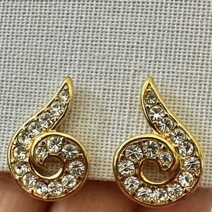 Monet gold tone rhinestone swirl clip on earrings